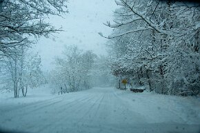 snow-day A snow storm covers the streets and the lake on the left